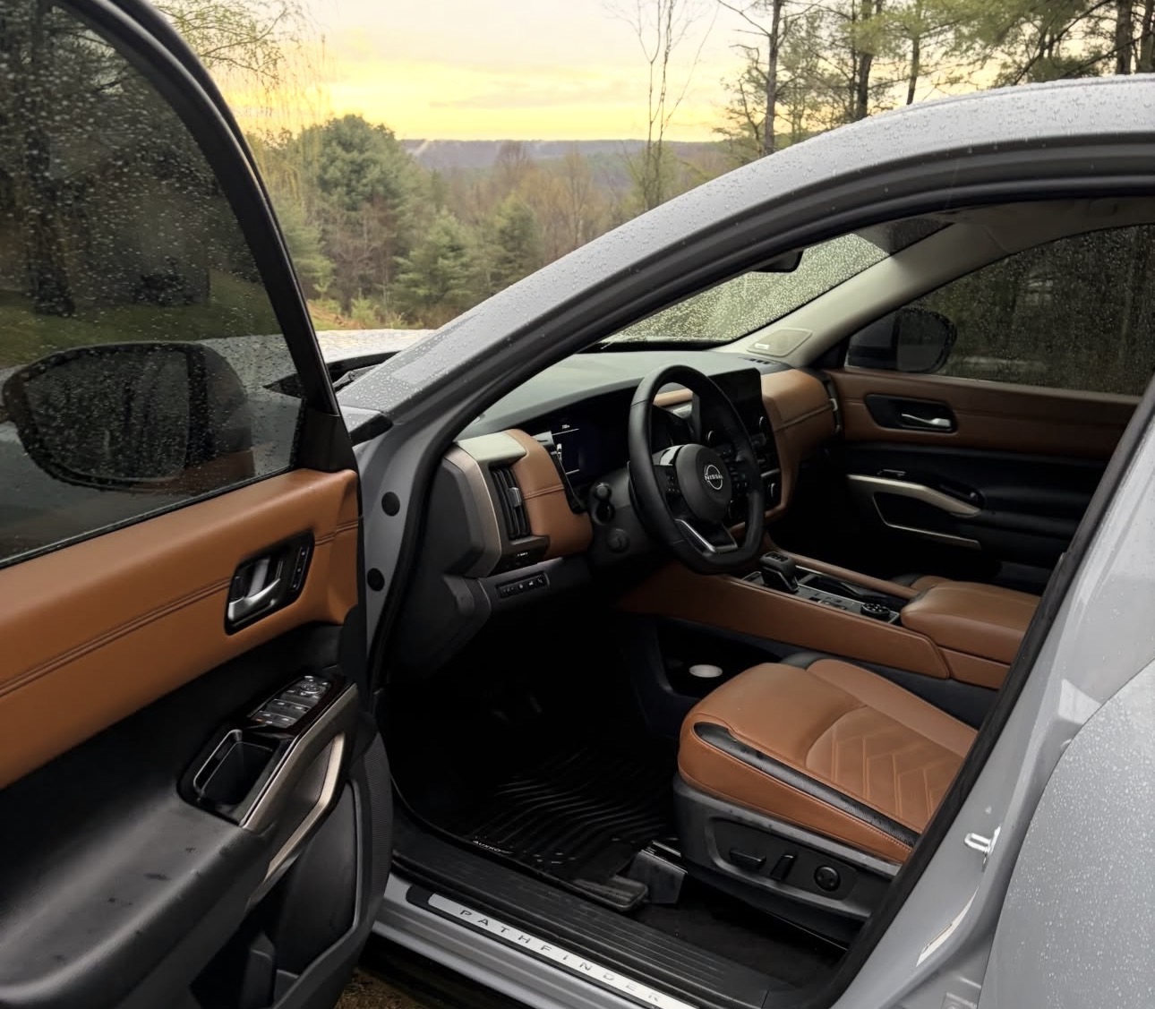 Detailed leather interior of a Nissan Pathfinder with rich tan seats